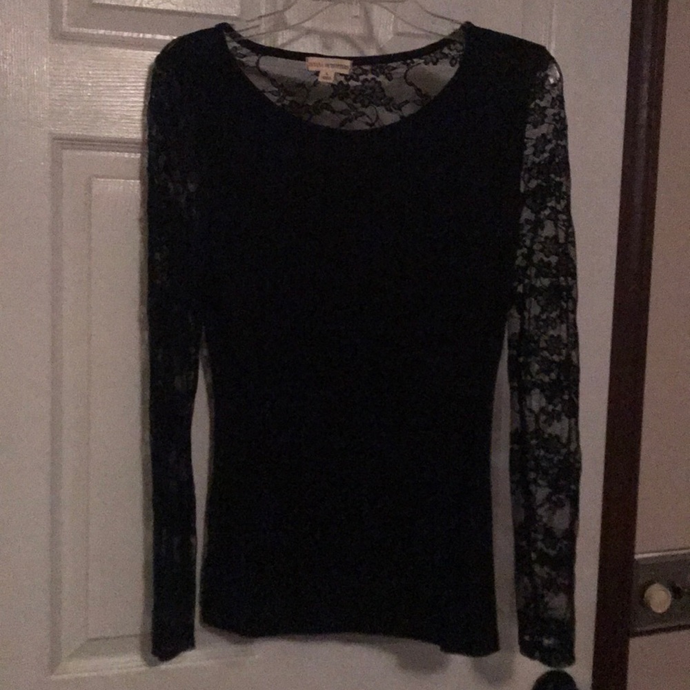 Large black laced back and sleeves shirt.